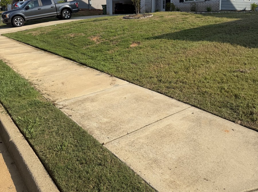 A clean cut edge where the lawn meets the sidewalk
